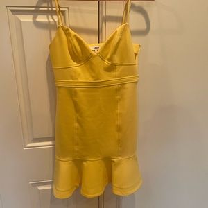Likely yellow mini dress